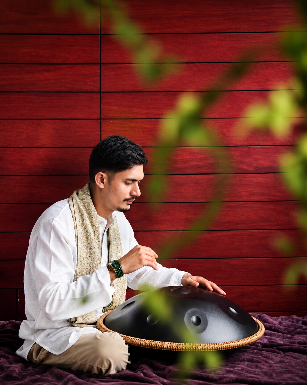 Tushar playing the handpan during a sound healing session